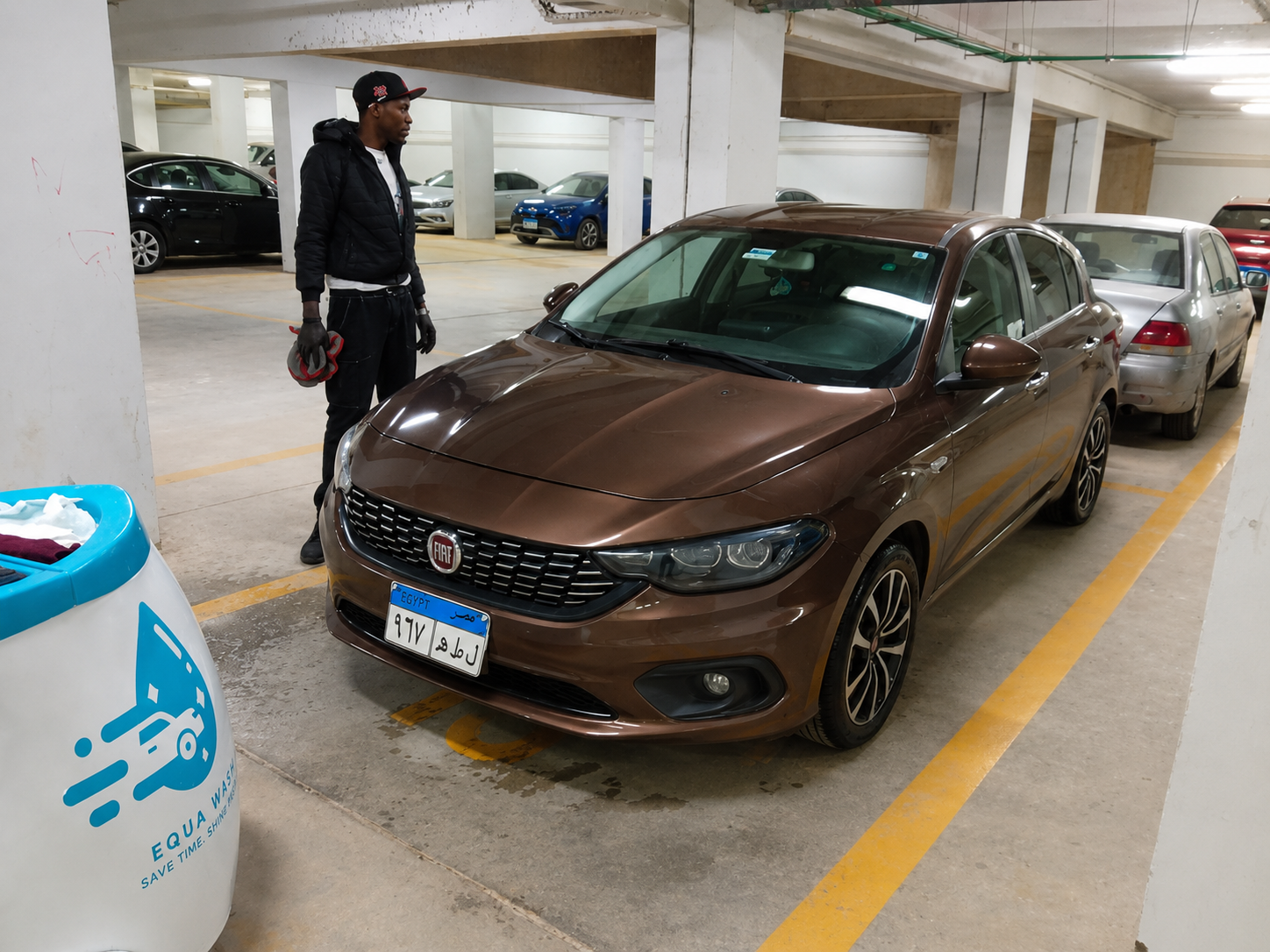 Equa Wash cart beside a brown Fiat Tipo in a clean underground garage