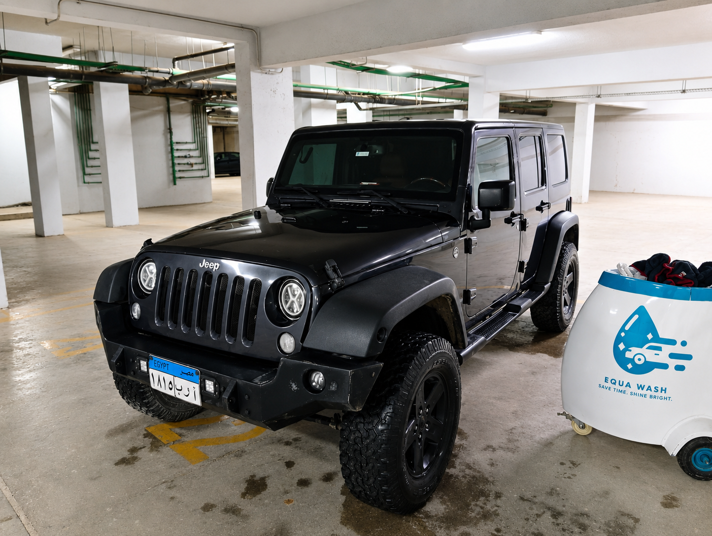 Equa Wash cart beside a black Jeep Wrangler in underground parking